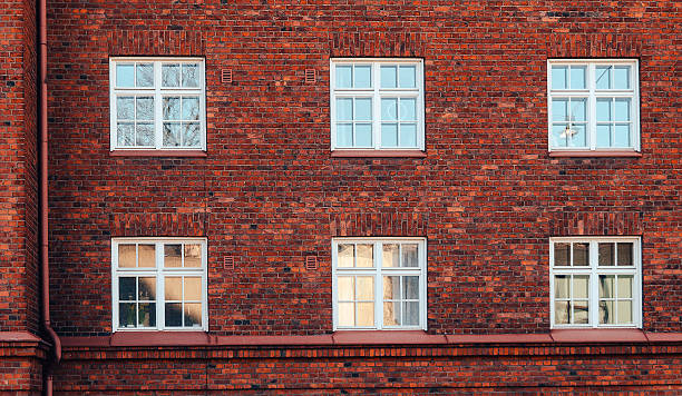 istock Old red brick wall with windows in Helsinki, Finland 600154934