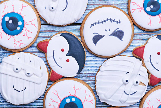 istock Handmade Halloween cookies on a wooden table 600155880