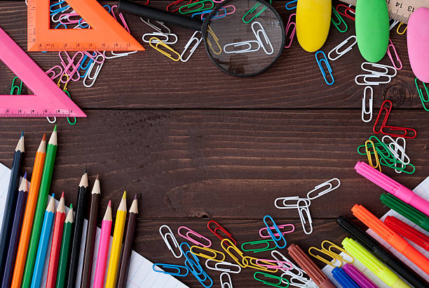 istock School supplies on a wooden table 600158704