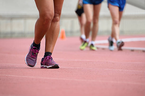 istock Girls on race walking on athletic track 600158890