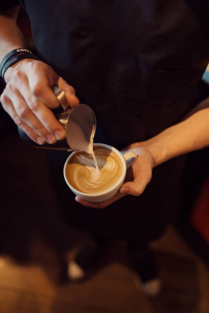 istock Barista at work in a coffee shop. Top view 600159152
