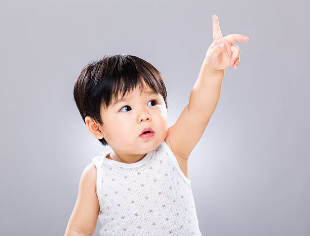 istock Chinese toddler reaching upwards 600160672