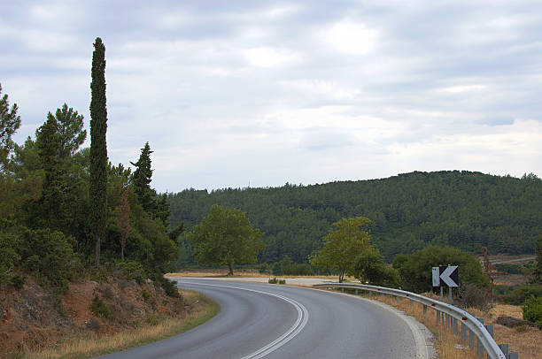 View of village in green and blue sky. Slope road low angle shoot.