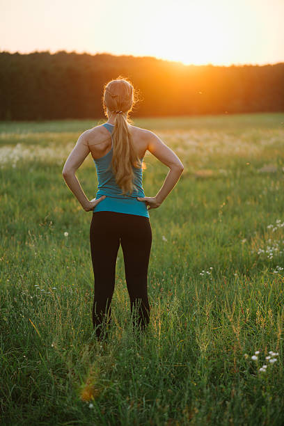 istock Female runner standing after a running session. 600162060