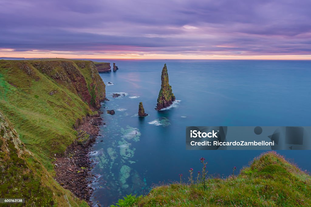 The Stack At The End Of The World One of the majestic Duncansby stacks near John O'Groats, Scotland. This is the actual northernmost point of the British isle and one of the main attraction in the northern Highlands. Scotland Stock Photo