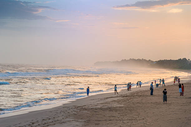 Koggala, Srilanla - July 12, 2016: Tourist enjoying the last sunlight on sunset beach,Koggala, Sri Lanka