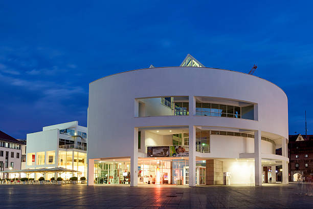 Ulm, Germany - Aug 17, 2016: Modern Stadthaus (city house) illuminated at night. City of Ulm, Baden Wurtemberg, Germany