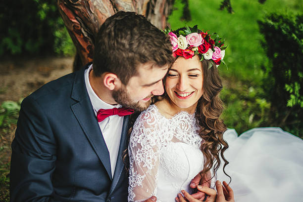 istock Bride & groom near old tree 600165798