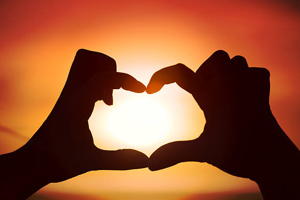 istock Silhouette of hand in heart shape 600167492