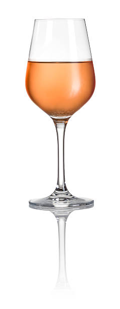 Glass filled with rose wine on a white background