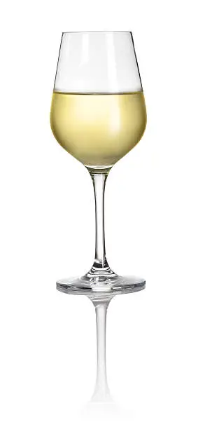 Glass filled with white wine on a white background