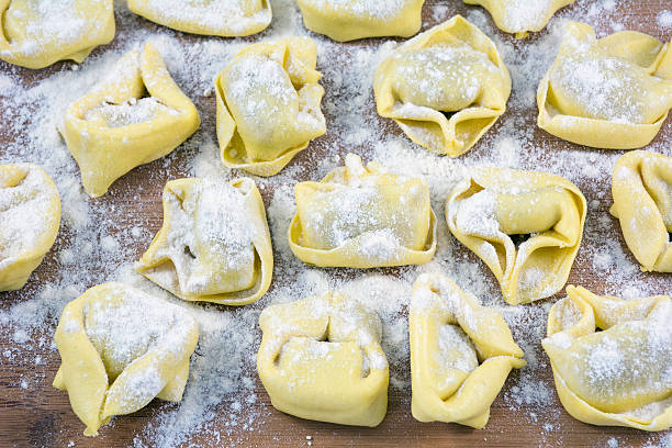 istock Row of raviolis in flour on the table 600170524