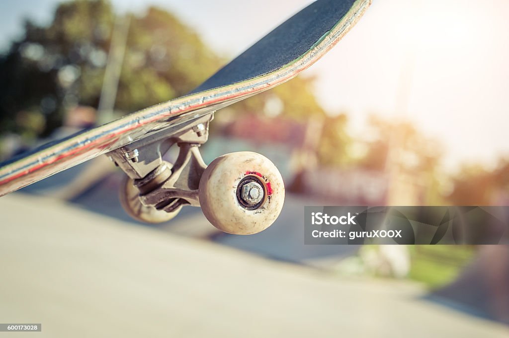 Close-up of skateboard in skatepark Close up of a skateboard wheel in skatepark Skateboard Stock Photo