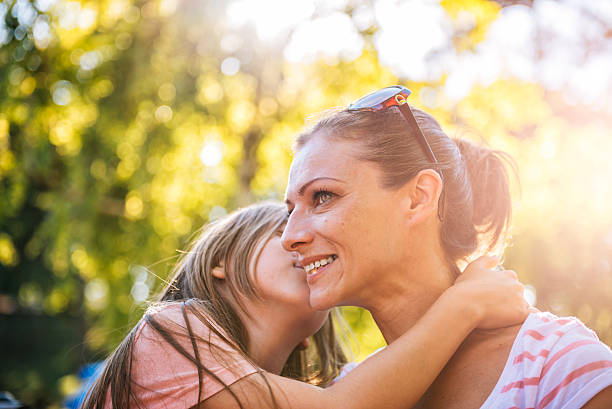 istock Mother and daughter in the park 600173370