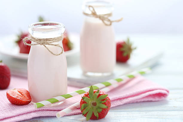 istock Strawberry yogurt in bottle on wooden table 600174120