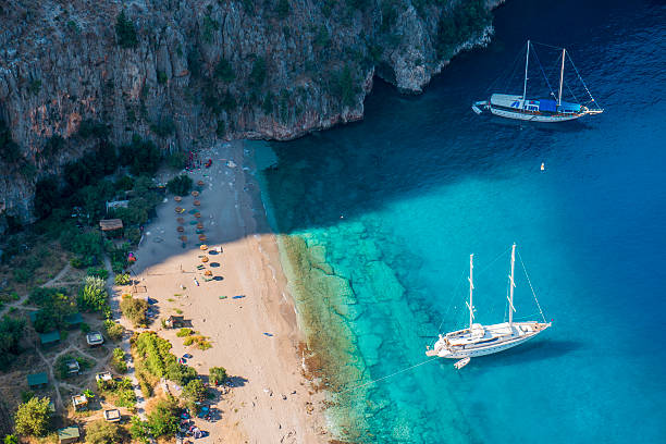 Butterfly Valley The Butterfly Valey in the city of Oludeniz/Fethiye in western Turkey. You can only reach this valey by boat.The Butterfly Valey in the city of Oludeniz/Fethiye in western Turkey. You can only reach this valey by boat. sunning butterfly stock pictures, royalty-free photos & images