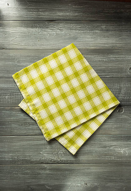istock cloth napkin on wooden background 600176396