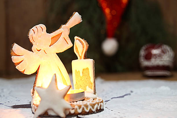 angel and burning candles decoration