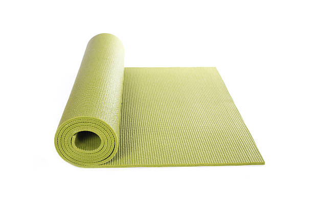 istock green yoga Mat and on white background 600372270