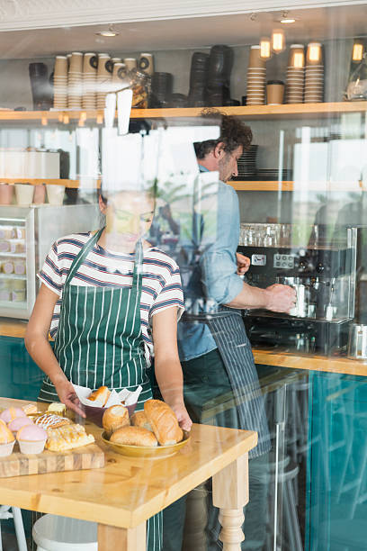 istock Waitress arranging dessert and snack on the counter 600372542