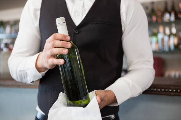 istock Waiter holding a bottle of wine 600372796