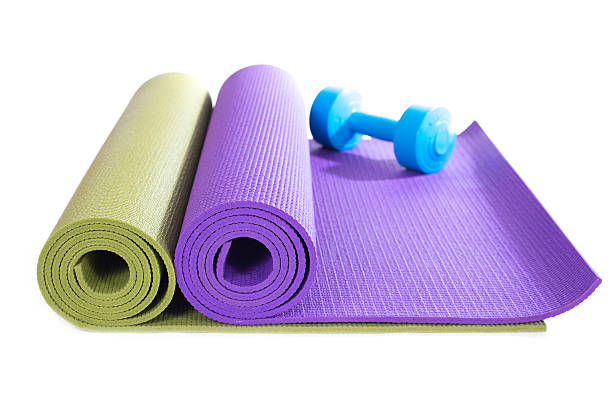 istock dumbbell and yoga mats on white background 600372820