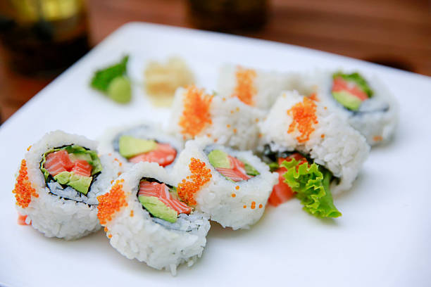 istock Rolls with salmon, avocado and caviar over white background 600373542