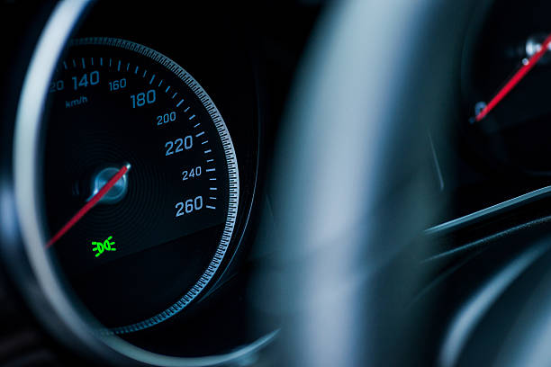istock Luxury car interior details. Speedometer, steering wheell 600373598