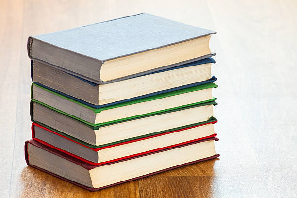 istock the lying multi-colored books on a wooden table. 600373970