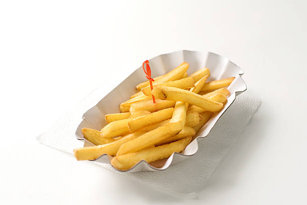 istock French fries in paper plate on white background 600374530