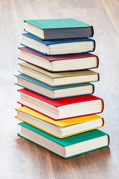 istock the lying multi-colored books on a wooden table. 600375834