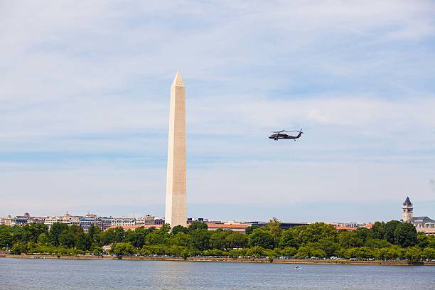 istock Military helicopter at the Washington Monument 600376282