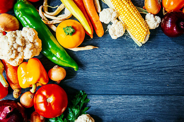 istock Many different vegetables on wooden background 600376372