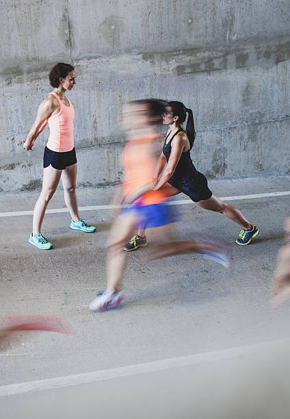 istock Group of Young Athletes Stretching Outdoors 600376678