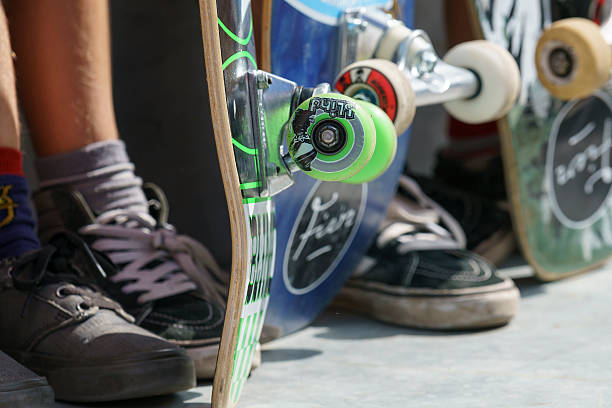 Skateboard wheels and feet stock photo