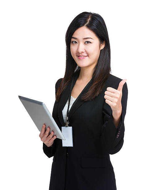 istock Chinese businesswoman holding a tablet 600377488