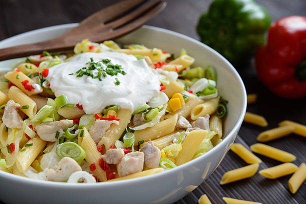istock Pasta salad with fried chicken meat and vegetable 600378474