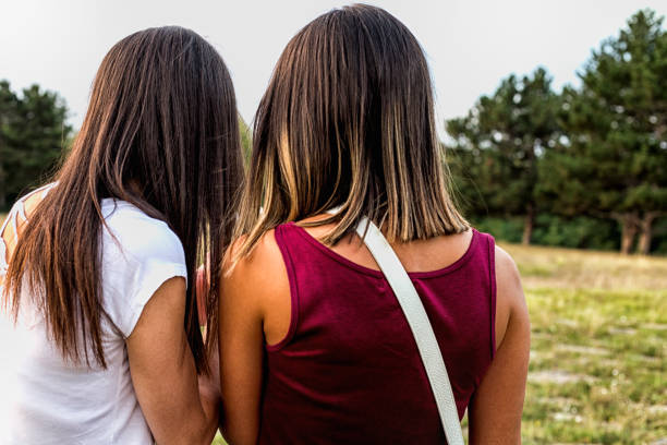istock Happy women in a park, view back view 600379060