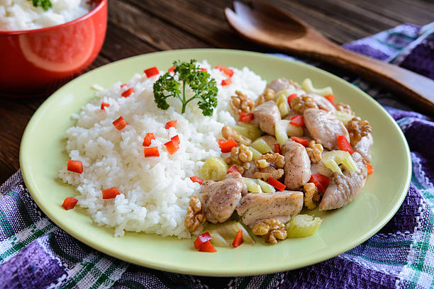istock Roasted chicken meat with stalk celery, roasted walnuts and rice 600381000