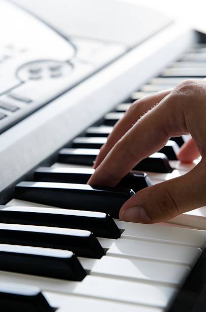 istock Piano keys of electronic keyboard musical instrument 600381178