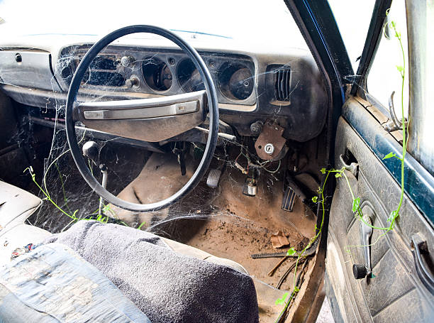 istock Driver's cockpit of a old car with spider web 600381396