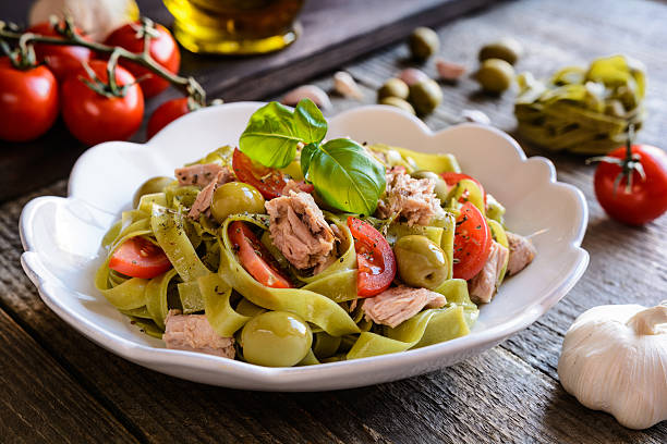 istock Tagliatelle pasta with tuna fish, tomato and olives 600385602