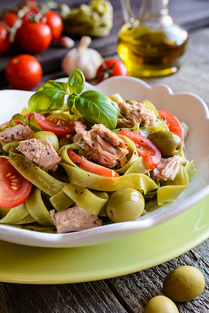 istock Tagliatelle pasta with tuna fish, tomato and olives 600385774