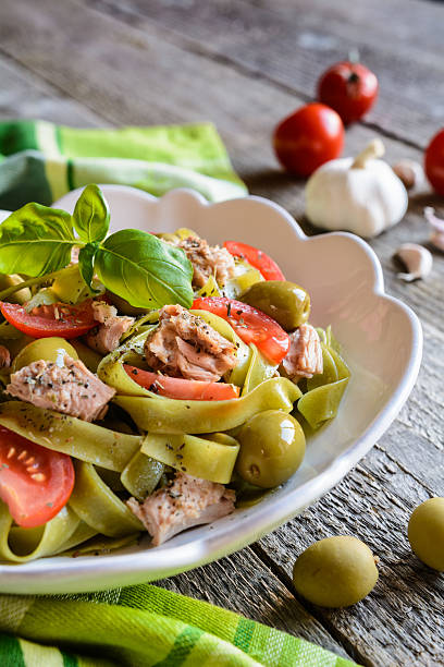 istock Tagliatelle pasta with tuna fish, tomato and olives 600385874