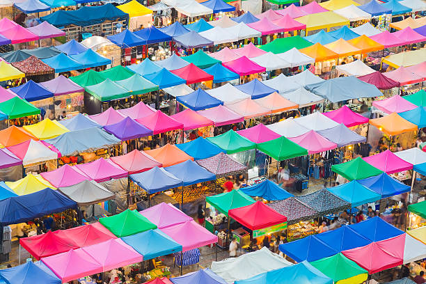 istock Multiple colour flea market rooftop, cityscape background 600386936