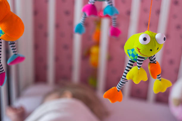 istock Baby mobile above the cradle; baby sleeping 600387614