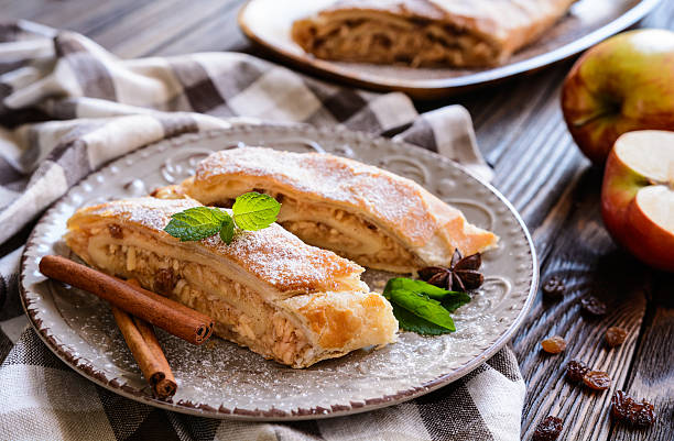 Traditional Apple strudel Traditional puff pastry strudel with apple and raisins filling austrian culture photos stock pictures, royalty-free photos & images