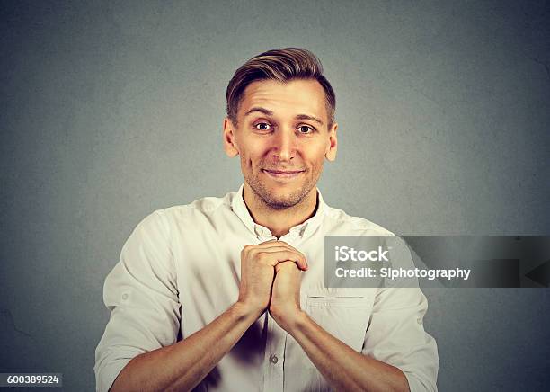 Man Showing Clasped Hands Pretty Please Stock Photo - Download Image Now - Adult, Begging - Social Issue, Men