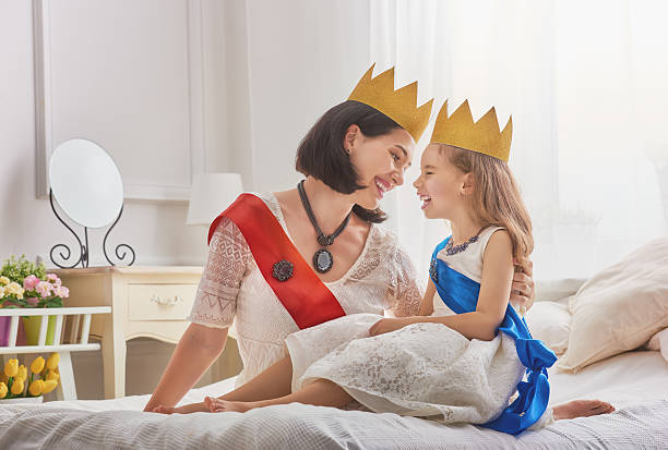 istock queen and princess in gold crowns 600390422