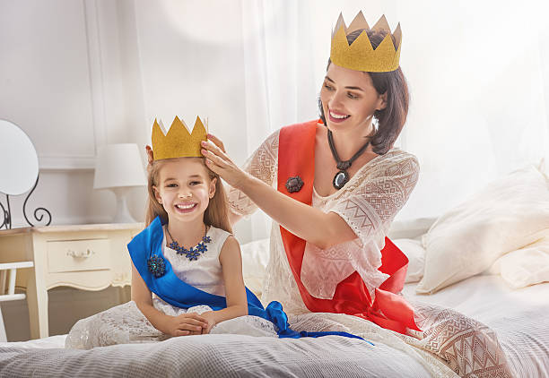 istock queen and princess in gold crowns 600390524